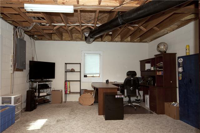 245 Quarry Road Mount Juliet, TN 37122 - Photo 17 of 19 The basement is partially finished, and the current owner uses it as his office space. With a little work, the room could be finished and used for anything you can dream up. The basement has a private entryway (french doors) as well.