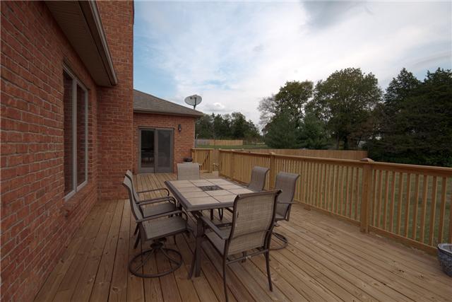 245 Quarry Road Mount Juliet, TN 37122 - Photo 18 of 19 A brand-new deck was added this summer, is located at the rear of the home, and overlooks the immense backyard (which is completely fenced!). As a nice treat, you could also set up an outdoor living space below the deck, as it's completely shaded.