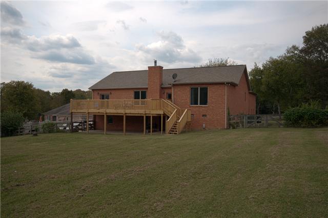 245 Quarry Road Mount Juliet, TN 37122 - Photo 19 of 19 View of the rear of the house. Not pictured is a naturally climate-controlled/lockable room (access below the deck) that has been mold-treated (preventative only), has a vapor barrier and electricity, so is perfect for additional storage.