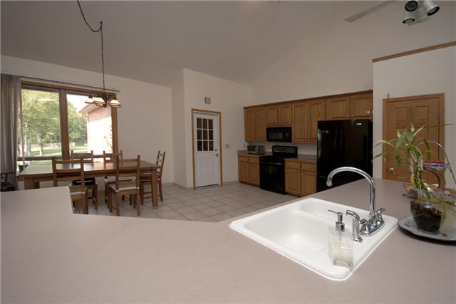 245 Quarry Road Mount Juliet, TN 37122 - Photo 4 of 19 Just through the main entryway is the great room area, which is a combined living/kitchen space. The eat-in kitchen allows for plenty of storage (oak cabinets) as well as prep room on the extra-long island/counter space.