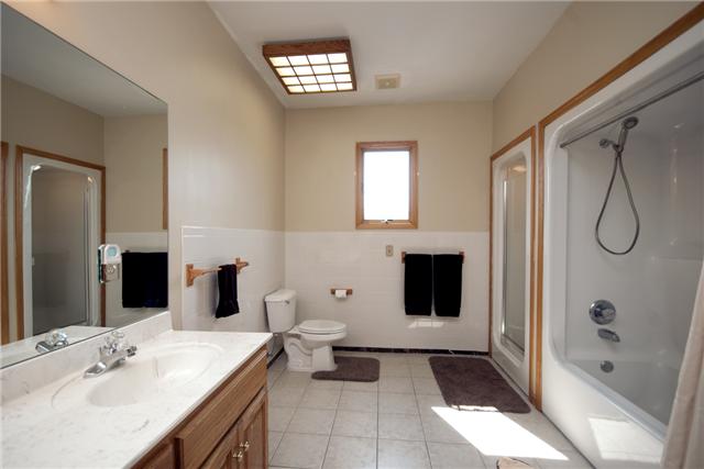 245 Quarry Road Mount Juliet, TN 37122 - Photo 10 of 19 The main bathroom is located between bedrooms two and three, has a double vanity, a full shower-tub combo, AND a standing shower as well!