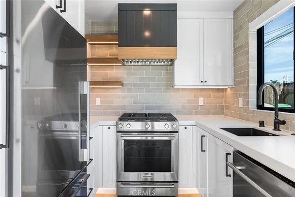 a kitchen with a stove and a microwave