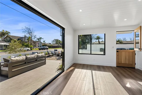 a view of a living room with furniture and a rug