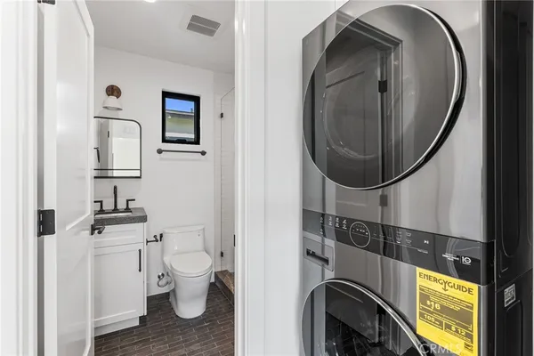 a bathroom with a toilet and a mirror