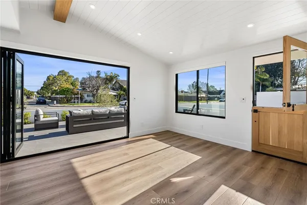 a view of a living room and a floor to ceiling window