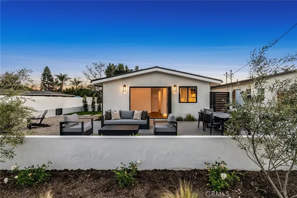 a view of a house with patio outdoor seating