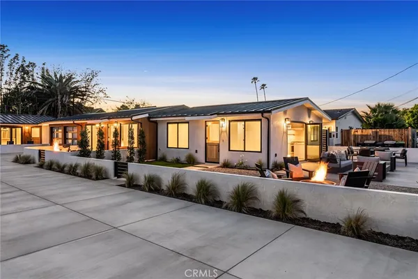 a view of a house with couches in front of house