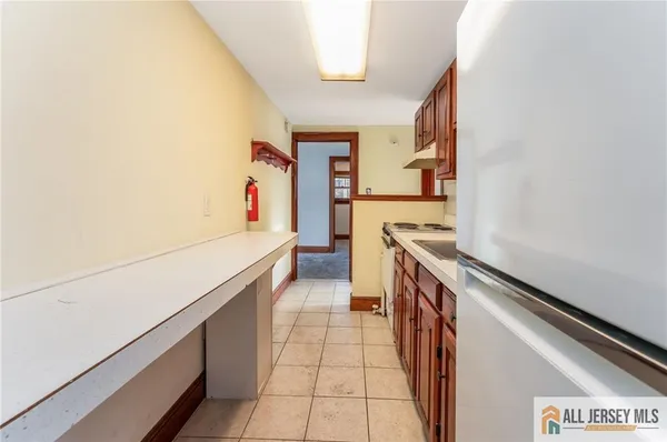 a kitchen with stainless steel appliances granite countertop a stove and a refrigerator