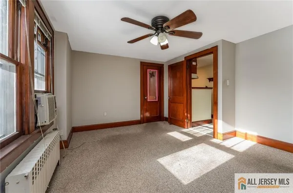 a view of a hallway with a chandelier