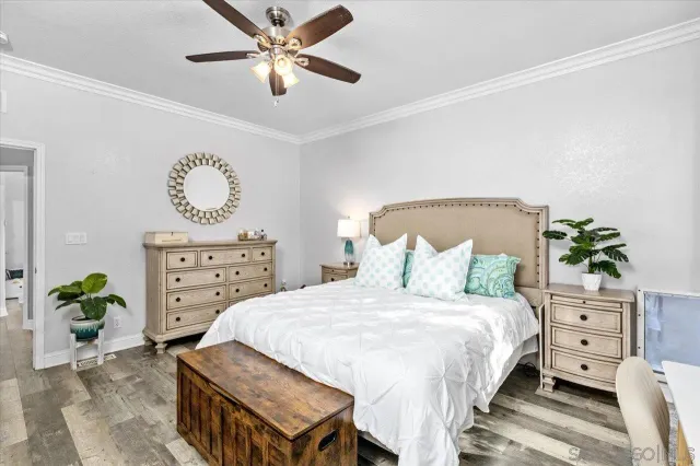 a bathroom with a granite countertop sink a mirror and a shower