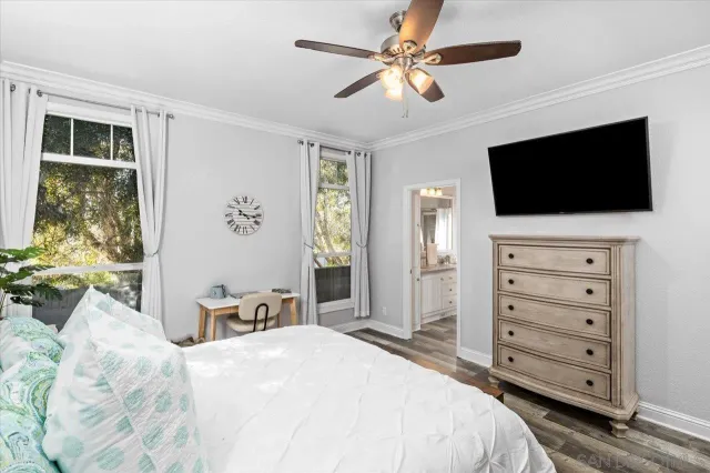 a bedroom with a bed and a book shelf