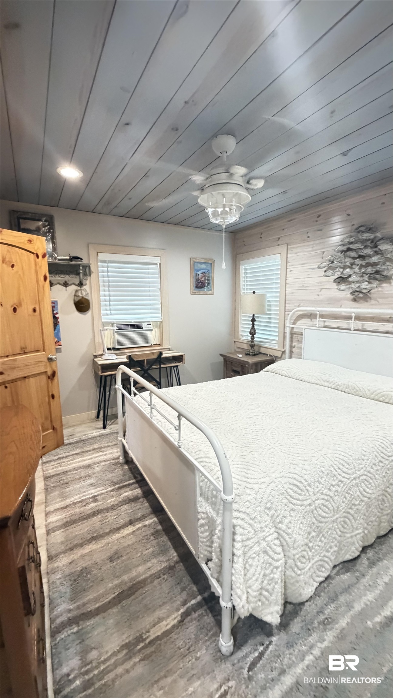 3983 Eureka Landing Road Uriah, AL 36480 - Photo 21 of 45 Bedroom with wooden ceiling, dark wood finished floors, wooden walls, and ceiling fan