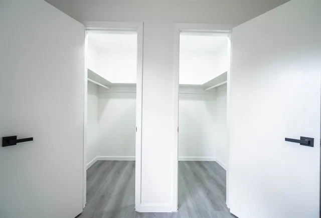 a view of a room that has wooden floor in it