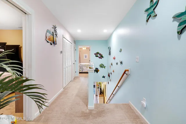 a view of entryway with stairs and wooden floor