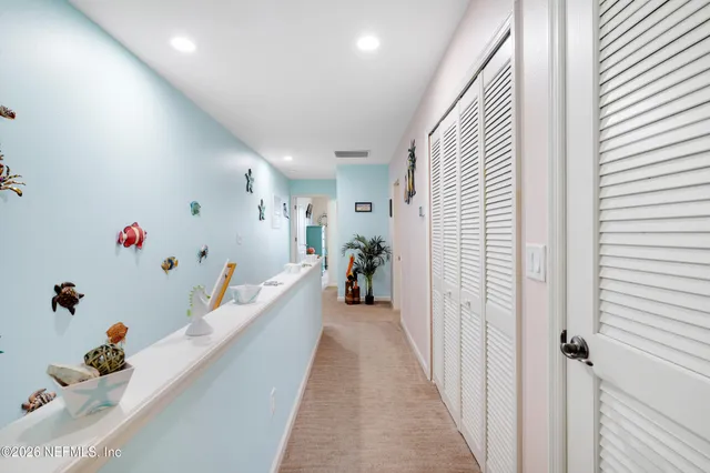 a hallway with toys and wooden floor
