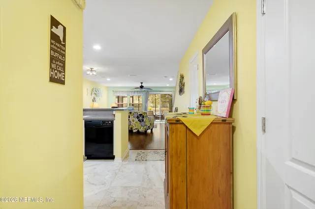 a kitchen with a refrigerator and a sink