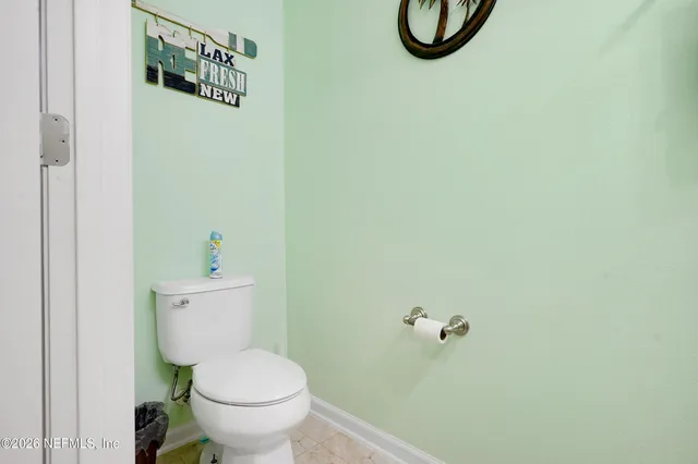a bathroom with a toilet and a vanity