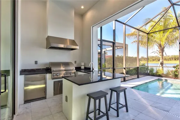 a kitchen with stainless steel appliances a stove a sink and cabinets