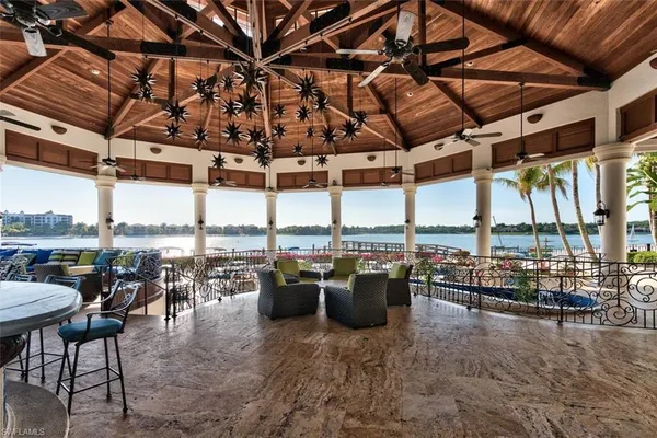 a view of a swimming pool with outdoor seating