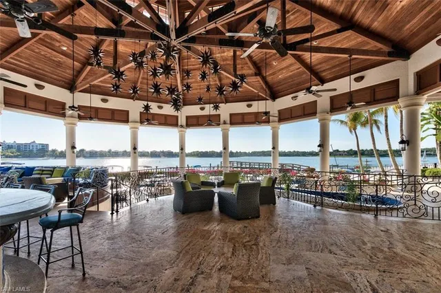 a view of a swimming pool with outdoor seating