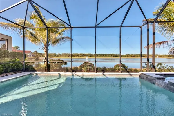 a view of a swimming pool with a lounge chairs