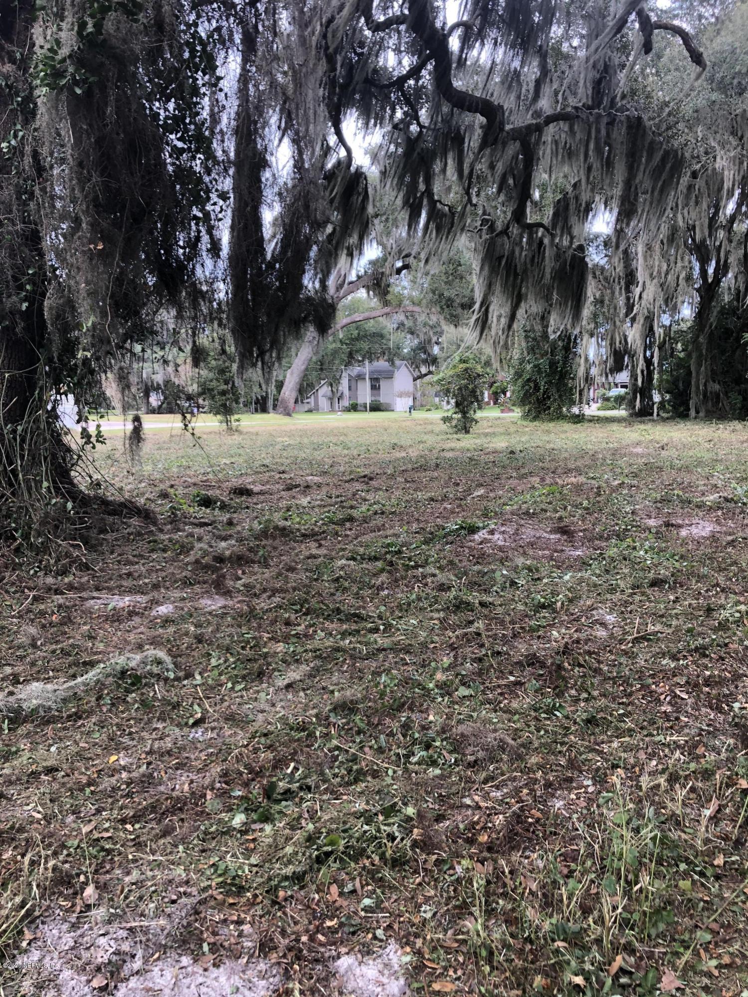 5573 Steamboat Road St. Augustine, FL 32092 - Photo 2 of 8 a view of road view with large trees