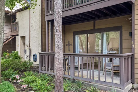 a view of a house with porch and wooden floor