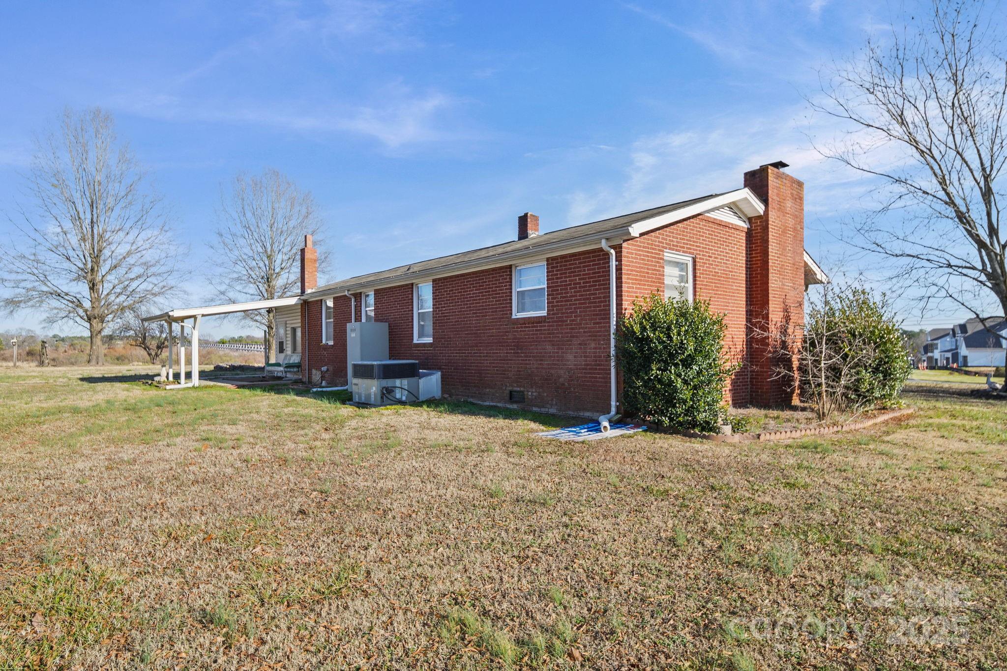 2601-2617 Olive Branch Road Monroe, NC 28110 - Photo 12 of 30 a front view of a house with a yard and garage
