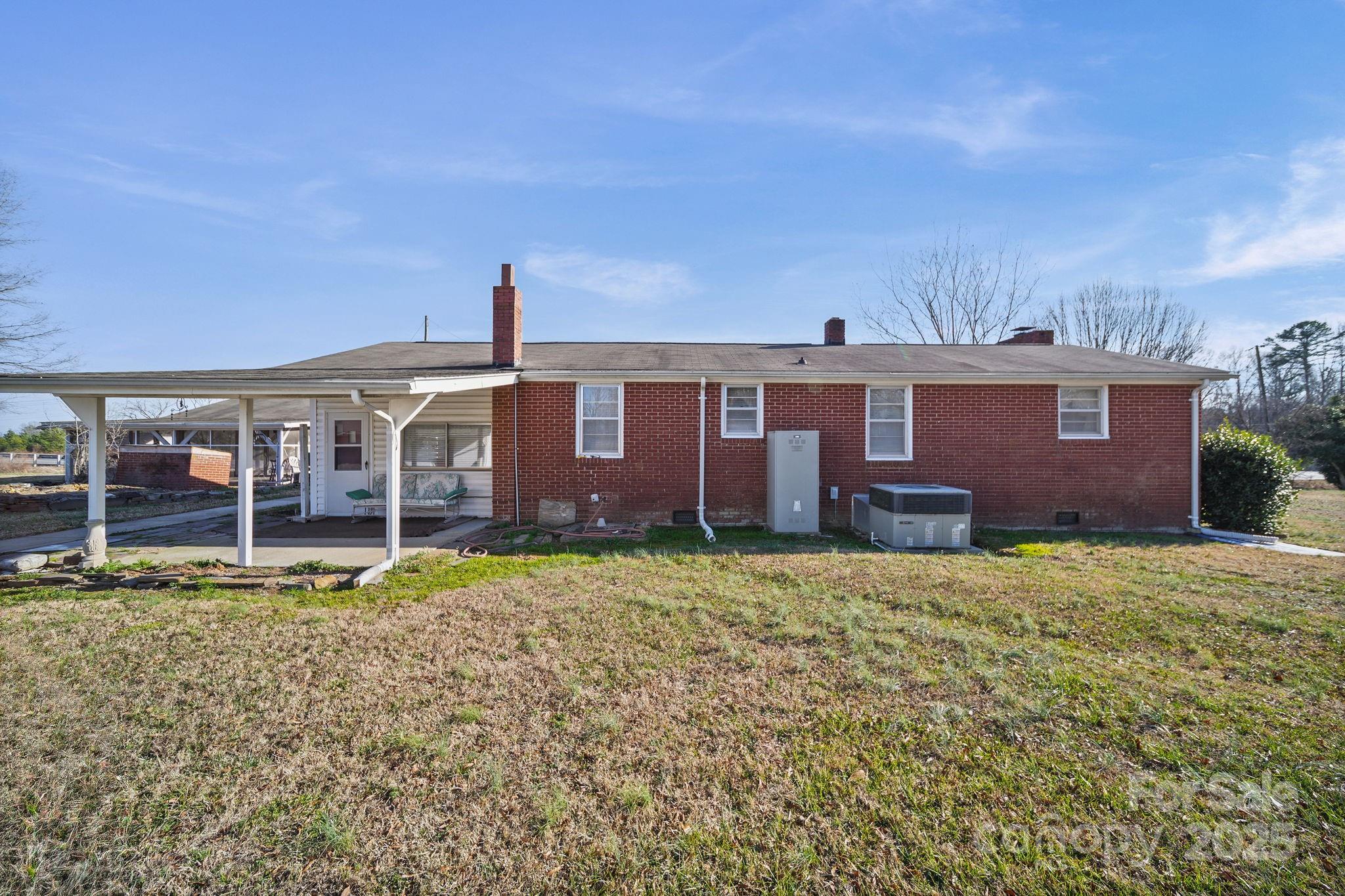 2601-2617 Olive Branch Road Monroe, NC 28110 - Photo 13 of 30 a front view of a house with garden