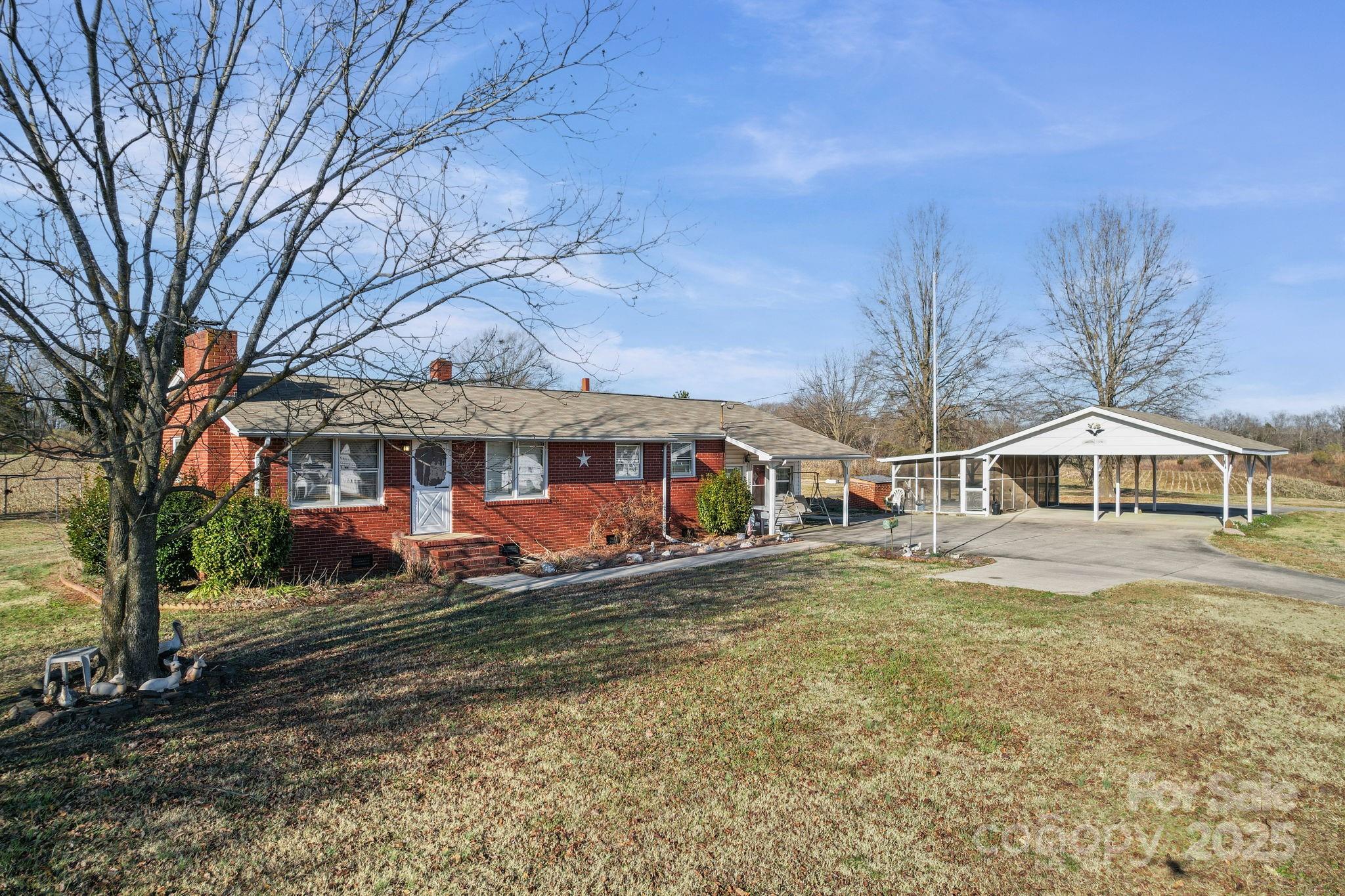 2601-2617 Olive Branch Road Monroe, NC 28110 - Photo 2 of 30 a front view of a house with a yard
