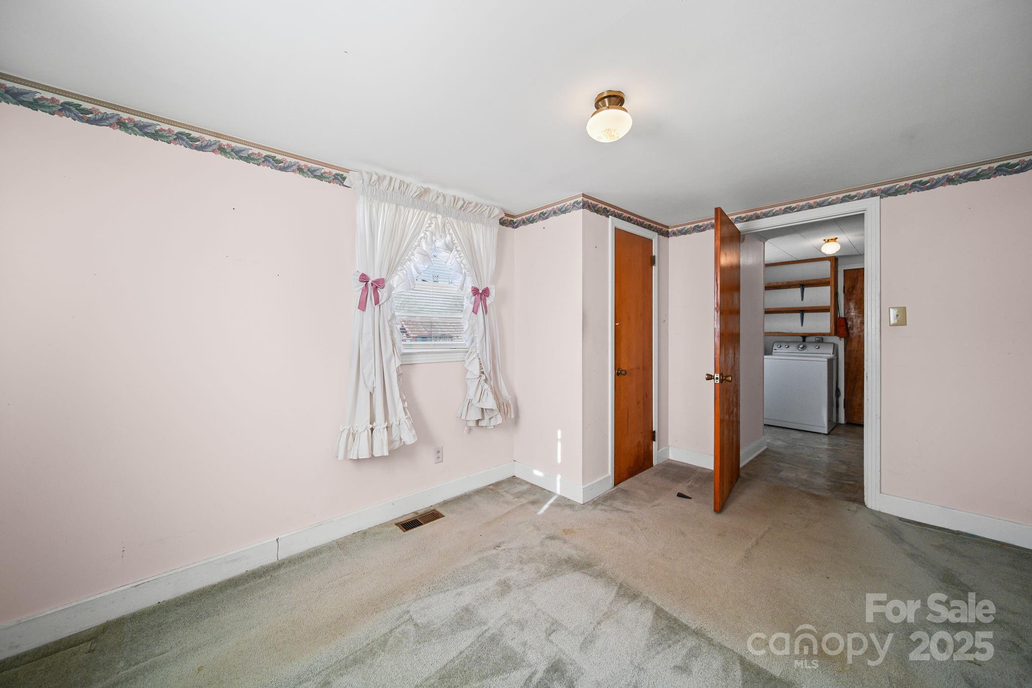 2601-2617 Olive Branch Road Monroe, NC 28110 - Photo 26 of 30 a view of walk in closet with window