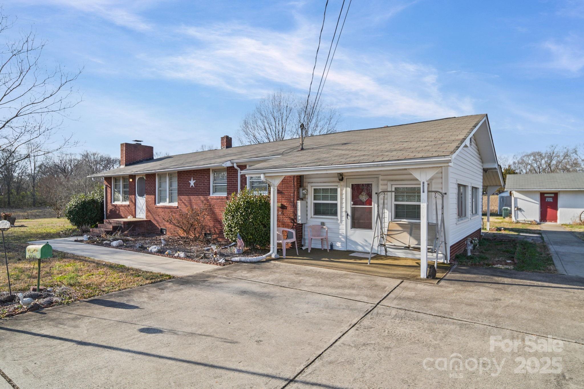 2601-2617 Olive Branch Road Monroe, NC 28110 - Photo 28 of 30 a front view of a house with basket ball court and porch