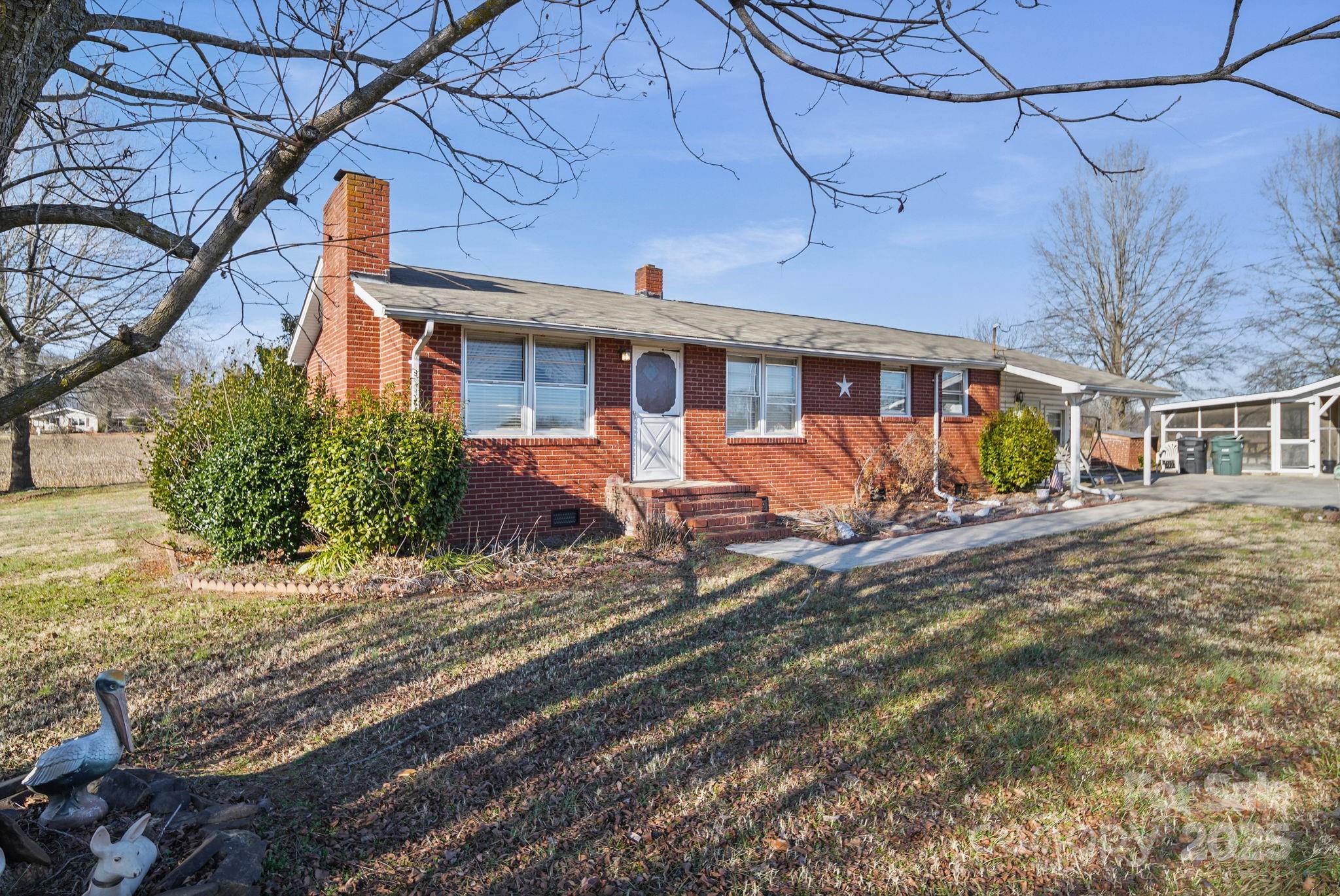 2601-2617 Olive Branch Road Monroe, NC 28110 - Photo 29 of 30 a front view of a house with large windows