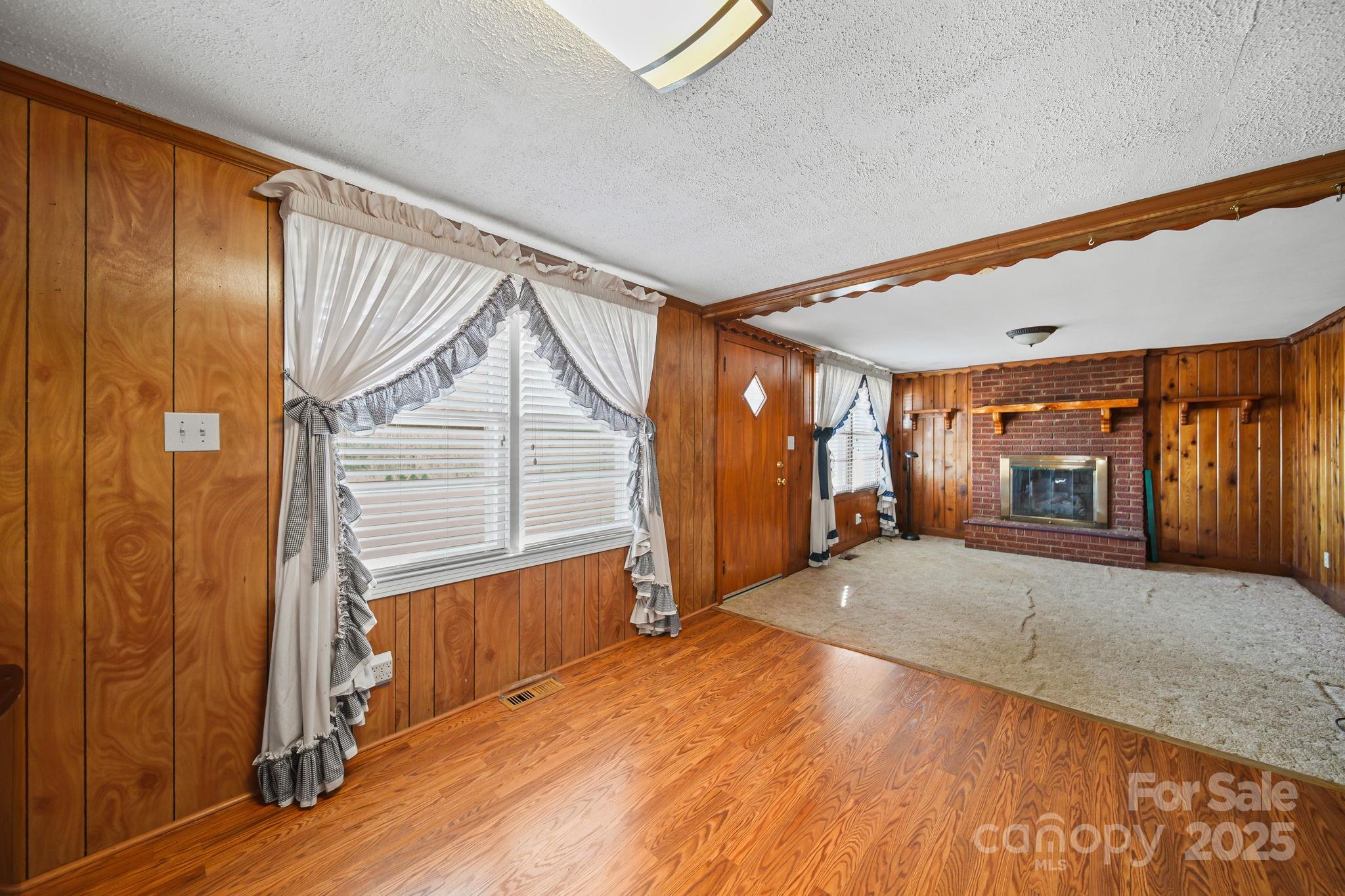 2601-2617 Olive Branch Road Monroe, NC 28110 - Photo 7 of 30 a view of hallway with wooden floor and windows