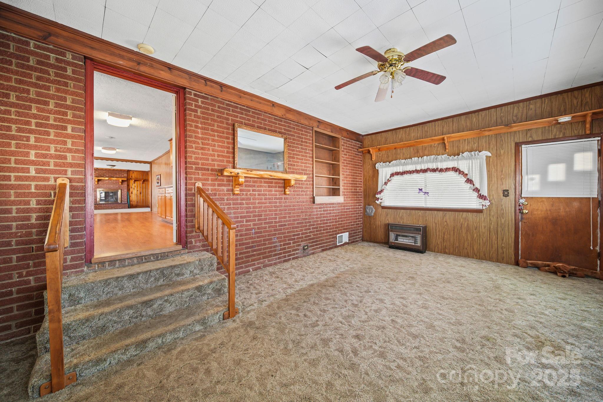 2601-2617 Olive Branch Road Monroe, NC 28110 - Photo 8 of 30 an empty room with ceiling fan and windows