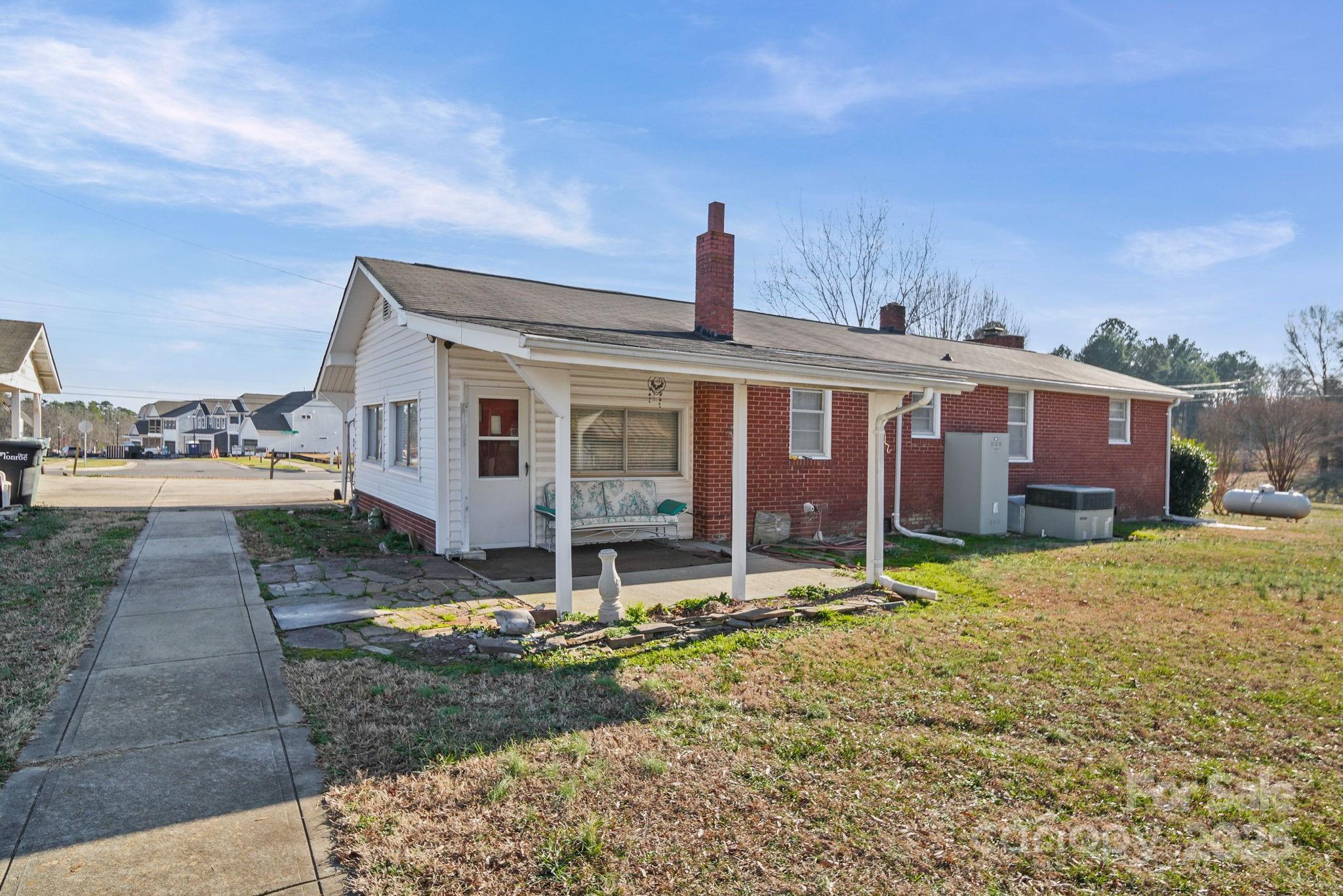 2601-2617 Olive Branch Road Monroe, NC 28110 - Photo 9 of 30 a front view of a house with a yard