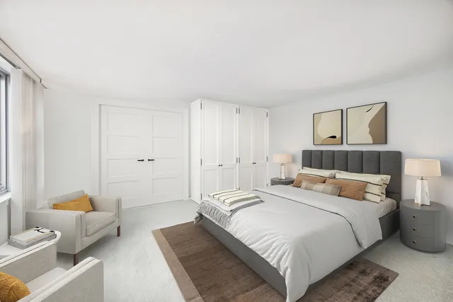 a bedroom with a bed and a couch