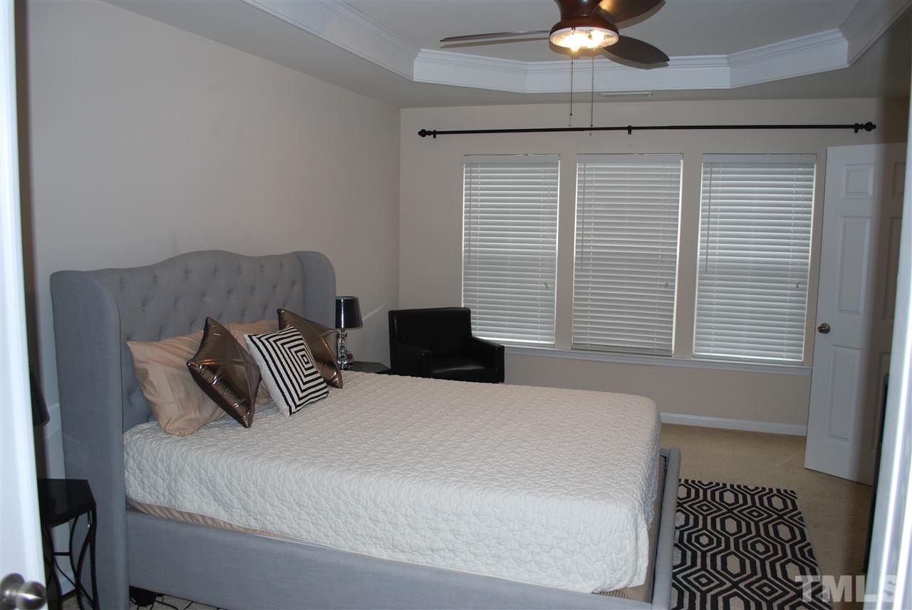 2619 Laurel Cherry Street Raleigh, NC 27612 - Photo 19 of 30 a bedroom with a bed and a window