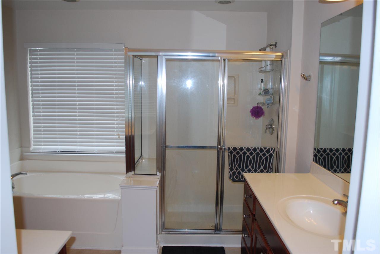 2619 Laurel Cherry Street Raleigh, NC 27612 - Photo 23 of 30 a bathroom with a bathtub and a shower