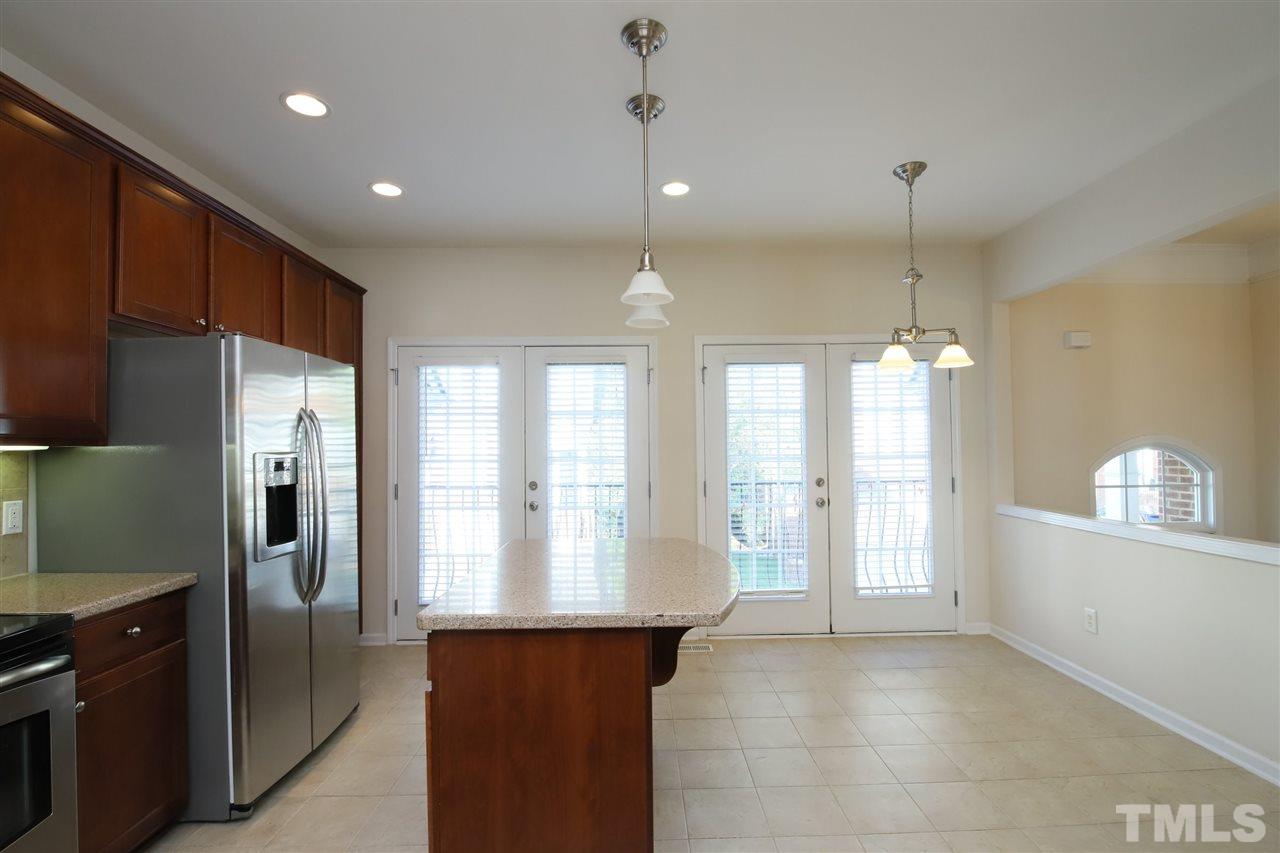 2619 Laurel Cherry Street Raleigh, NC 27612 - Photo 9 of 30 a open kitchen with refrigerator and window
