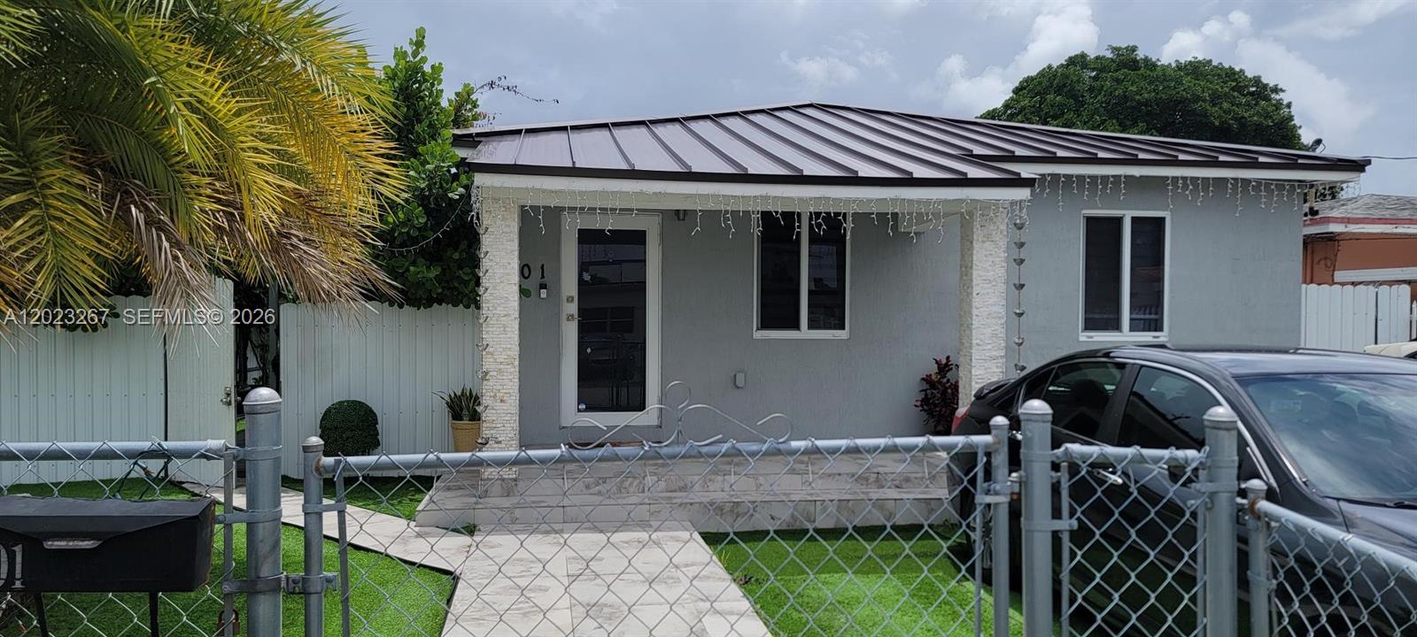 301 Southwest 36th Avenue Miami, FL 33135 - Photo 1 of 32 a front view of a house with garden
