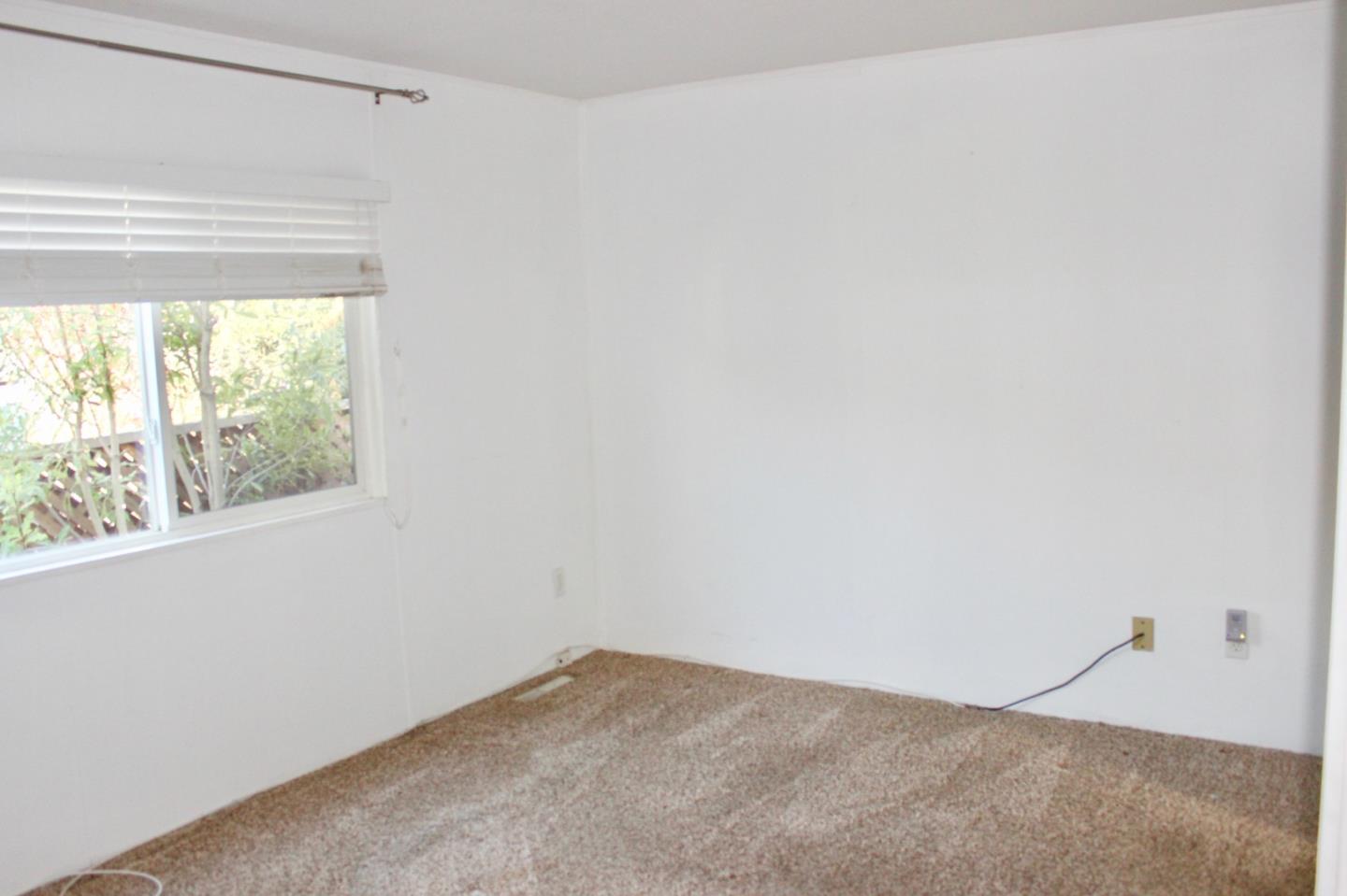 930 Rosedale Avenue, Unit 35 Capitola, CA 95010 - Photo 12 of 18 a view of an empty room and window