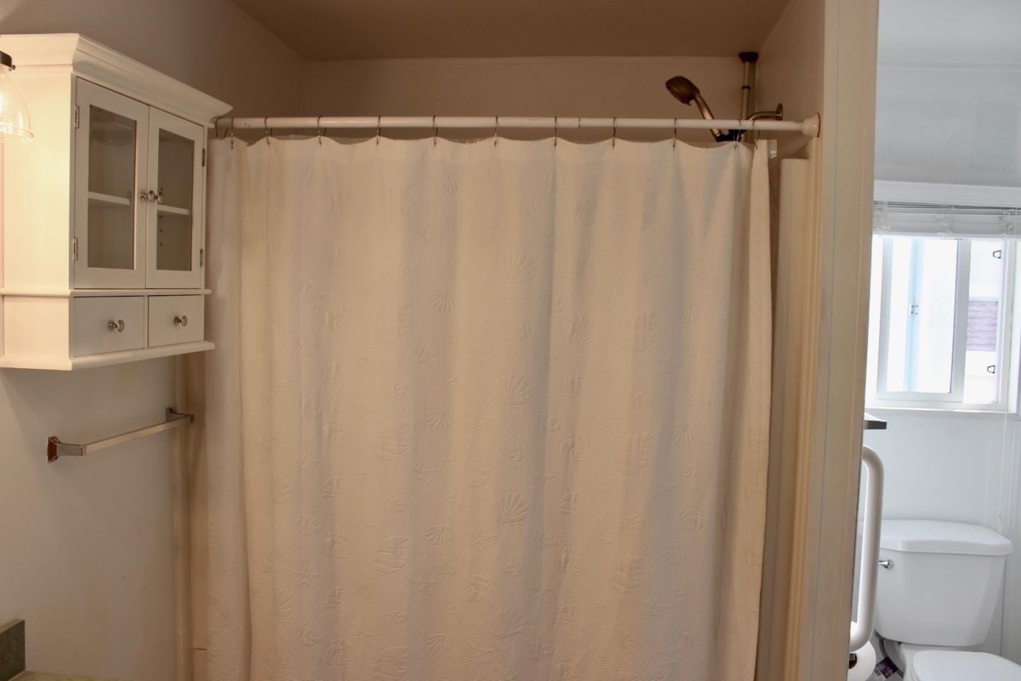 930 Rosedale Avenue, Unit 35 Capitola, CA 95010 - Photo 17 of 18 a bathroom with a shower and a tub