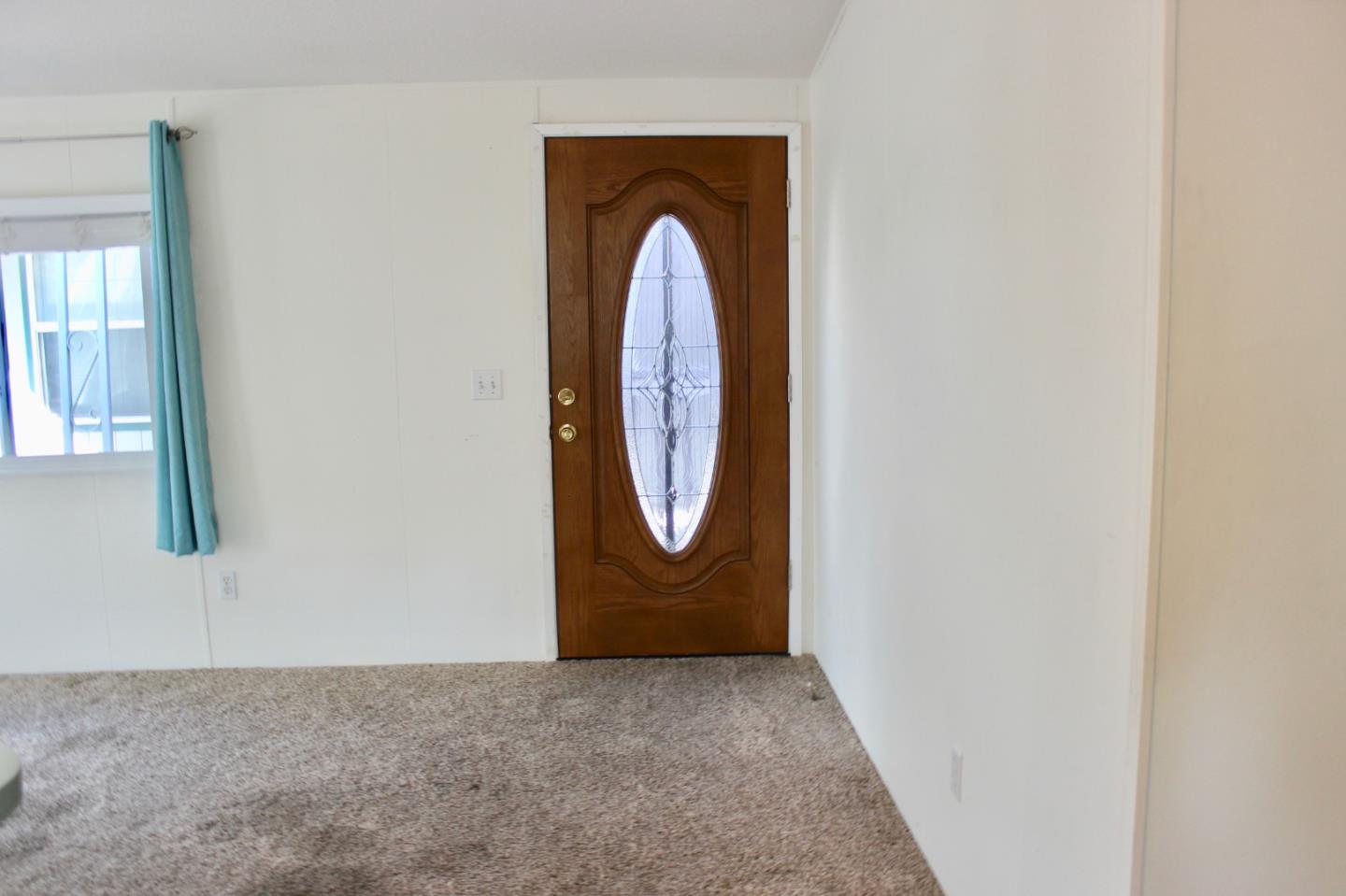 930 Rosedale Avenue, Unit 35 Capitola, CA 95010 - Photo 3 of 18 a view of a livingroom with front door