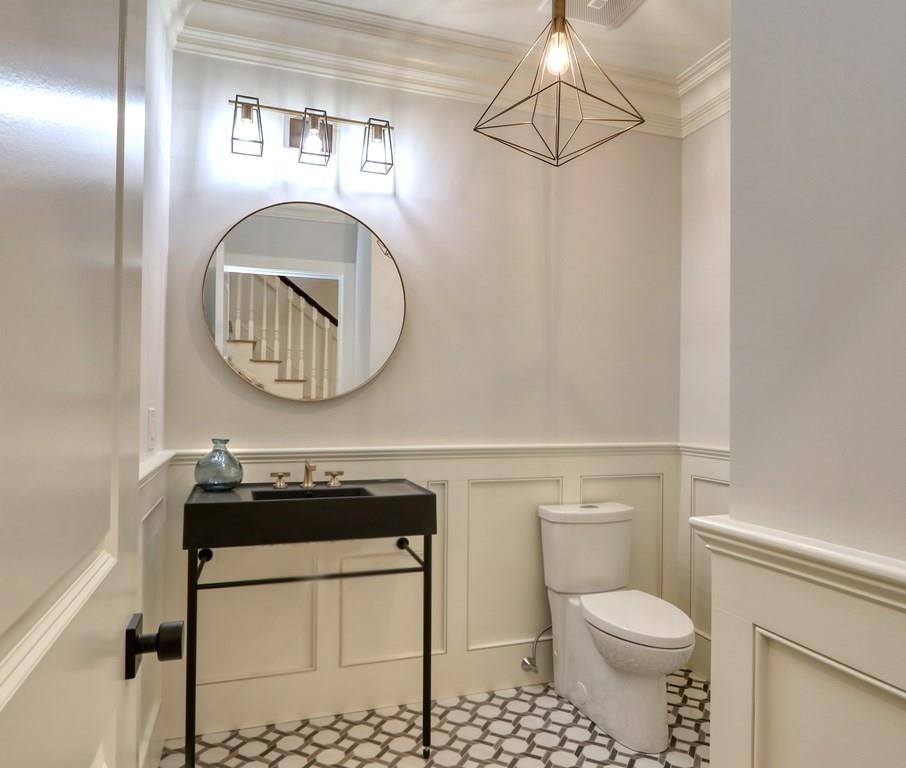 135 Waban Hill Road North Newton, MA 02467 - Photo 13 of 36 a bathroom with a toilet a sink and a mirror