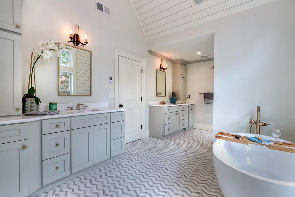 135 Waban Hill Road North Newton, MA 02467 - Photo 18 of 36 a spacious bathroom with a double vanity sink mirror and bathtub