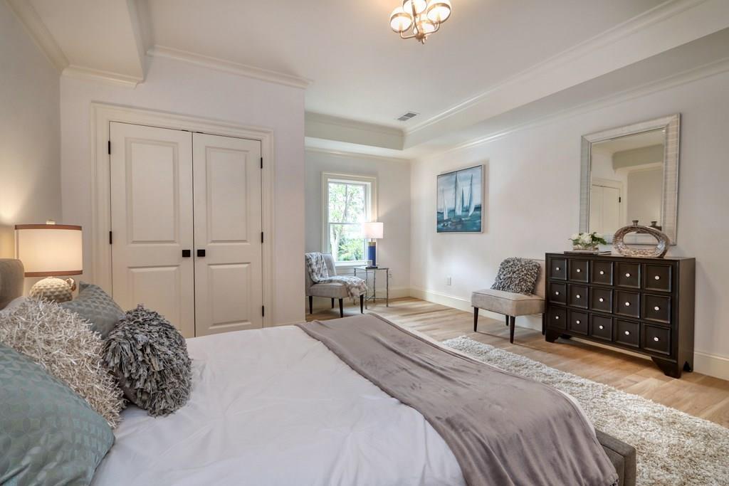 135 Waban Hill Road North Newton, MA 02467 - Photo 21 of 36 a bedroom with a bed and a dresser