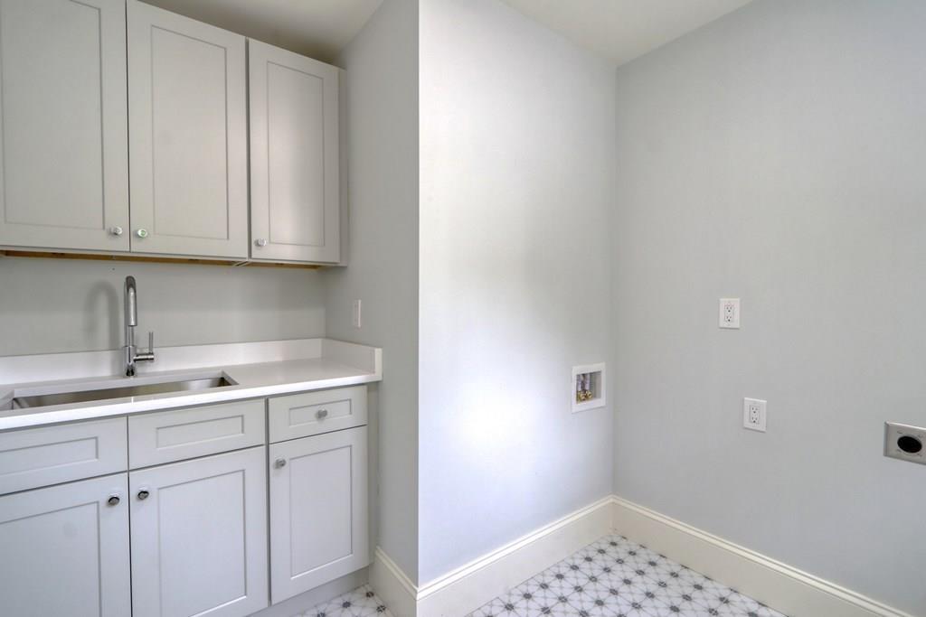 135 Waban Hill Road North Newton, MA 02467 - Photo 25 of 36 a bathroom with a sink and cabinets