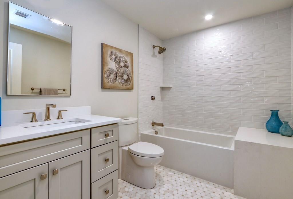 135 Waban Hill Road North Newton, MA 02467 - Photo 27 of 36 a bathroom with a granite countertop sink a toilet and a bathtub
