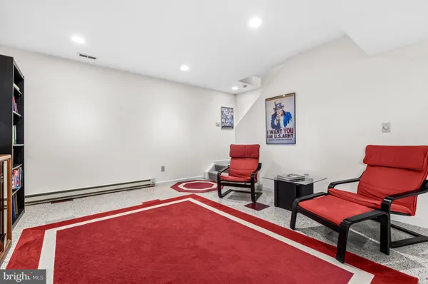 a room with gym equipment and a gym machine